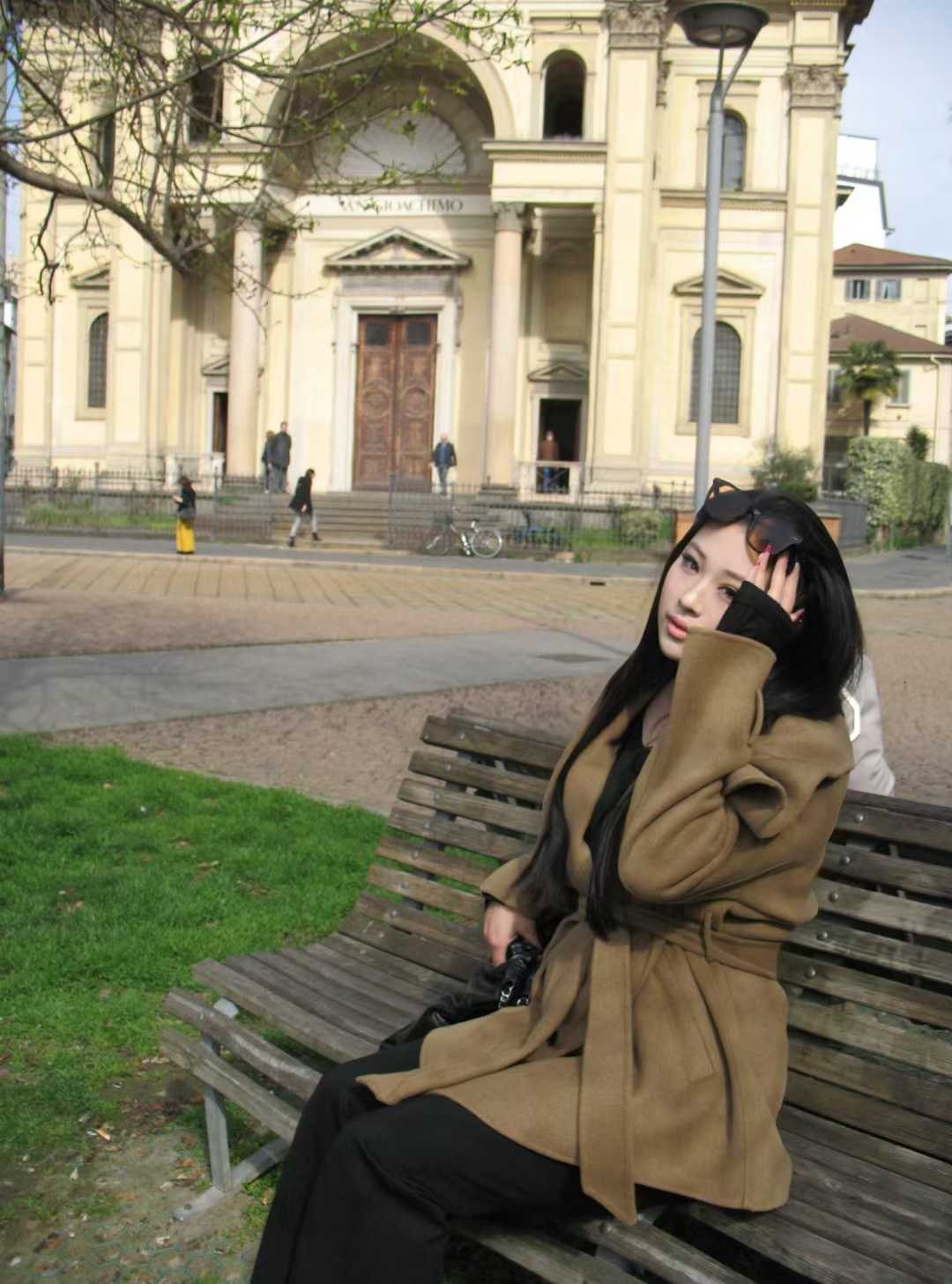 Naomi Tang in front of an architectural landmark in Milan